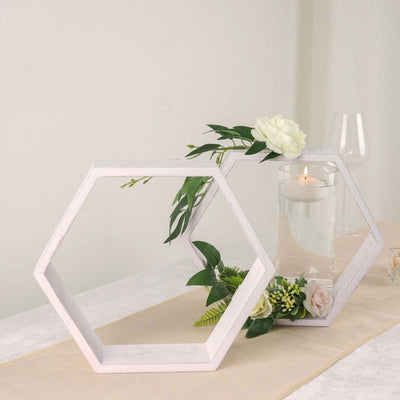 Decorative hexagon frames with flowers and candle centerpiece