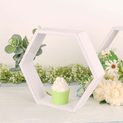 Decorative hexagon shelf with a green cupcake and flowers