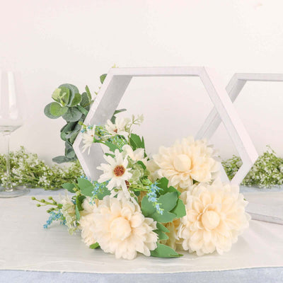 Floral arrangement with cream-colored flowers and greenery in a modern decor setting.
