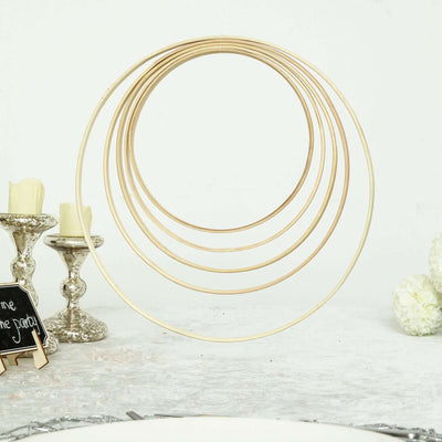 Gold decorative hoop set against a white background.