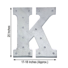 A galvanized metal letter K that is 20 inches tall for indoor lighting