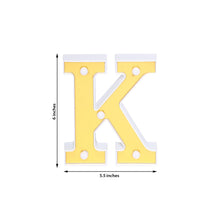 Indoor lighting, letters & table numbers: Plastic yellow letter k that is 5.5 inches tall