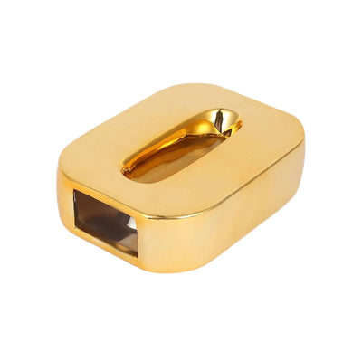 Golden rectangular paperweight with a slot design.