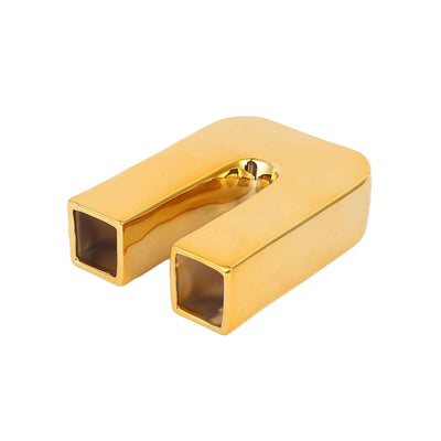 Gold rectangular magnet with a shiny finish.