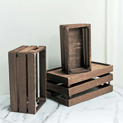Wooden storage crates in various sizes on a marble surface.