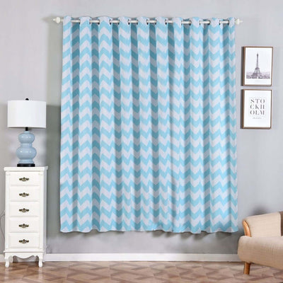 Blue chevron patterned curtains hanging in a stylish living room setting.
