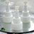 Miniature white wedding cake decorations with heart toppers. #whtbkgd