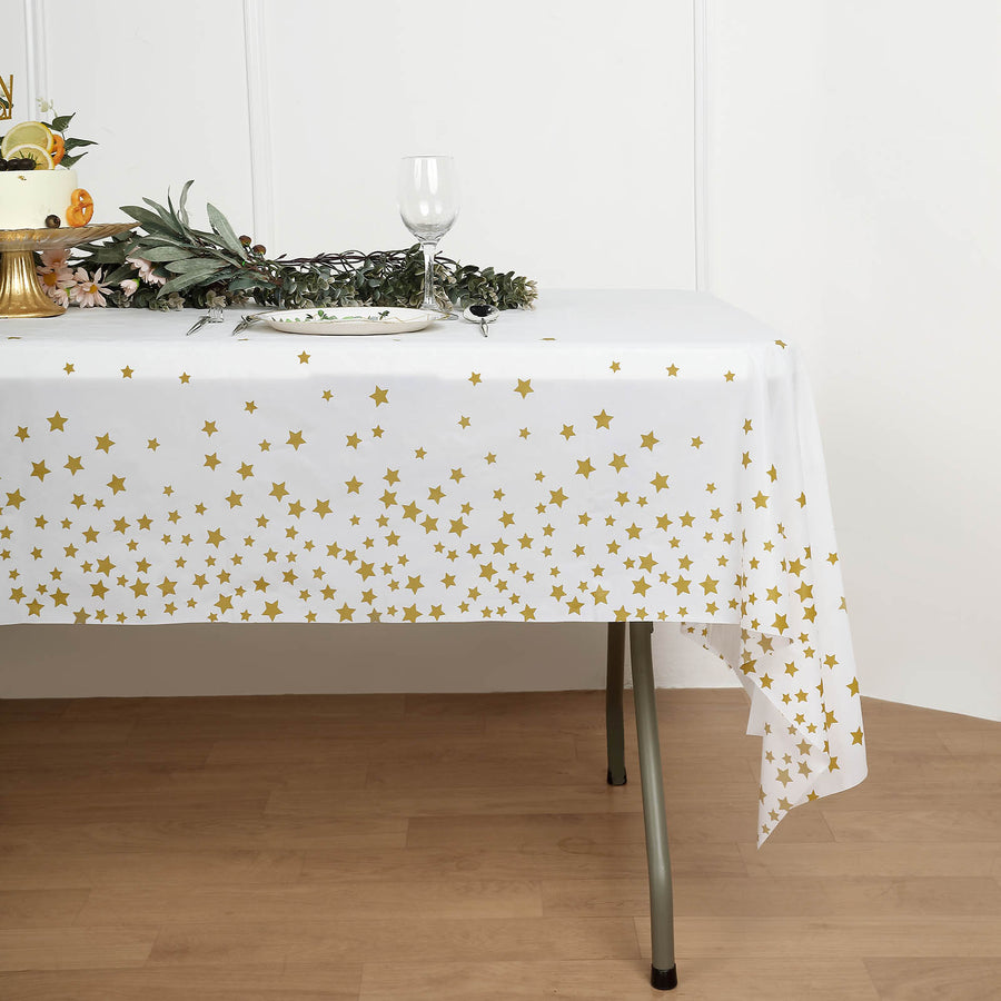 54 Inch x 108 Inch White and Gold Star Sprinkled Plastic Waterproof Rectangle Disposable Tablecloth