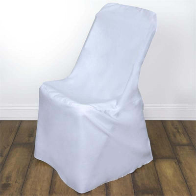 White chair cover draped over a chair on a wooden floor.