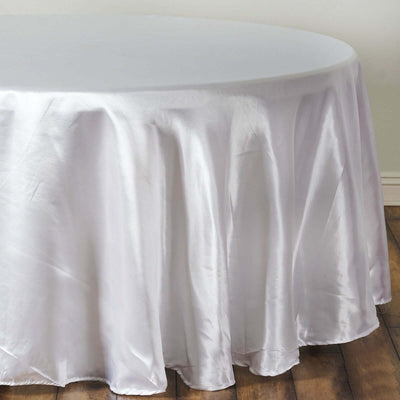 White satin tablecloth draping elegantly over a round table.