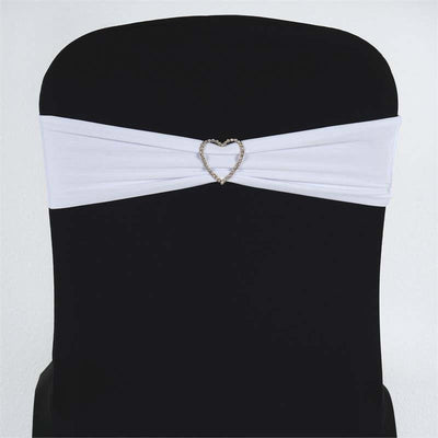 White chair sash with heart-shaped rhinestone embellishment.
