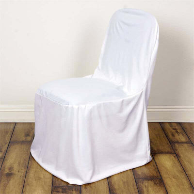 White chair cover draped over a chair on wooden floor.