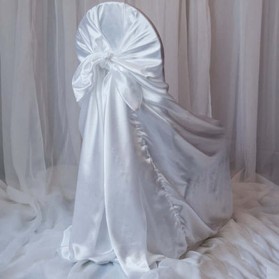 Elegant white satin chair cover with bow detail.