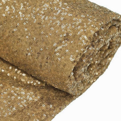Gold sequin fabric roll for crafting and decoration.