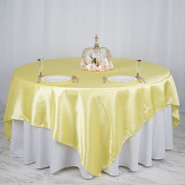 Add Elegance to Your Event with the Yellow Satin Table Overlay