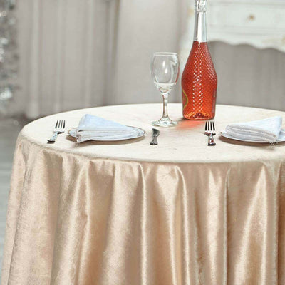 Elegant dining setup with a champagne bottle, glass, and neatly arranged napkins.