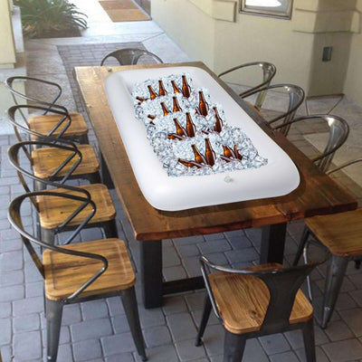Inflatable cooler with ice and bottles on a wooden table