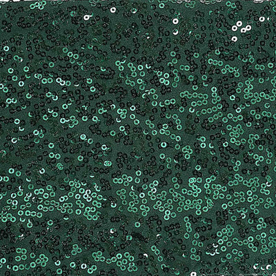 Green sequin fabric texture with shimmering details.