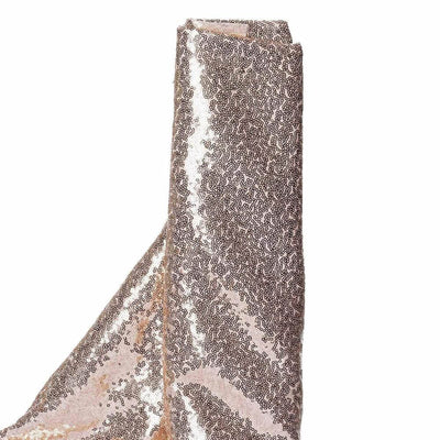 Sparkly rose gold fabric roll with intricate sequin design